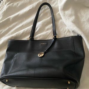 Authentic Furla Tote hardly used purchased it in Florida comes with garment bag